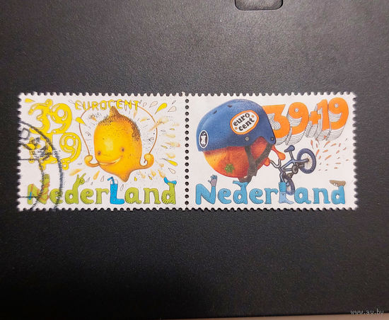 Нидерланды 2004. Детские марки. Спорт. Лимон. Апельсин (сцепка из 2 марок)