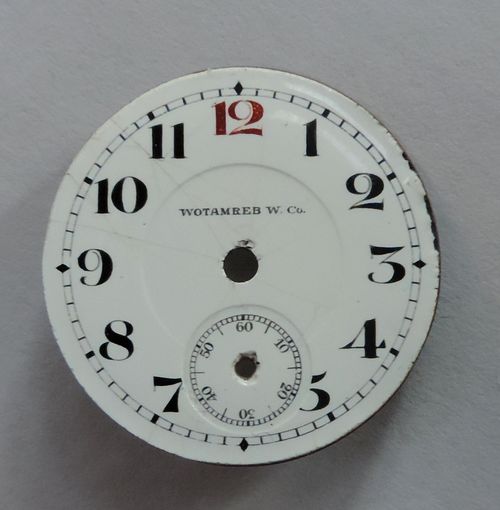 Циферблат эмалевый от наручных мужских часов до 1917г. "Wotamreb". Диаметр 2.9 см.